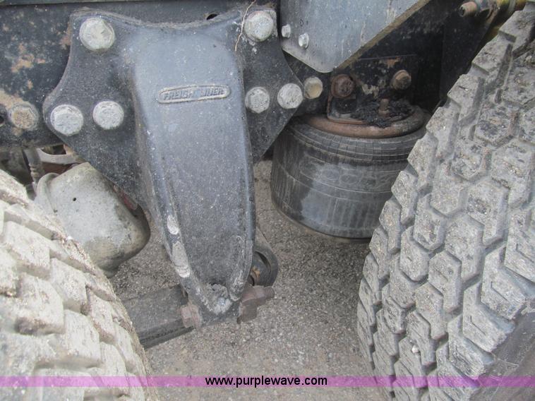 image for item H8999 1999 Freightliner FLC120 semi truck