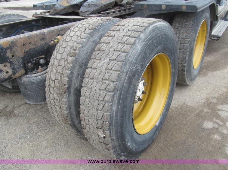 image for item H8999 1999 Freightliner FLC120 semi truck