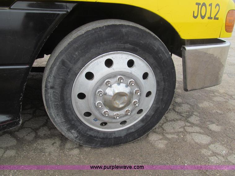 image for item H8999 1999 Freightliner FLC120 semi truck