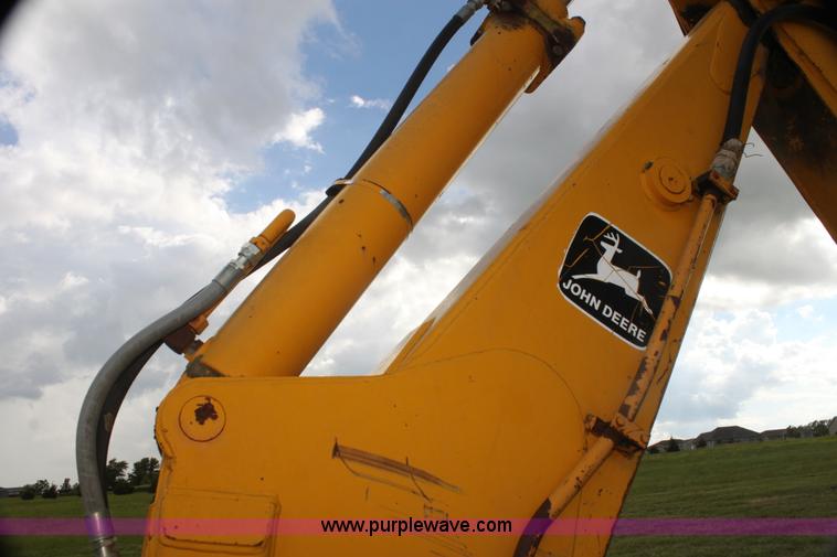 image for item I7382 1988 John Deere 710B backhoe