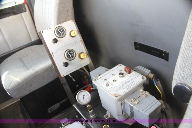 image for item I7395 2001 Volvo WG Super Stone Slinger semi truck