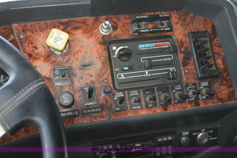 image for item I7395 2001 Volvo WG Super Stone Slinger semi truck