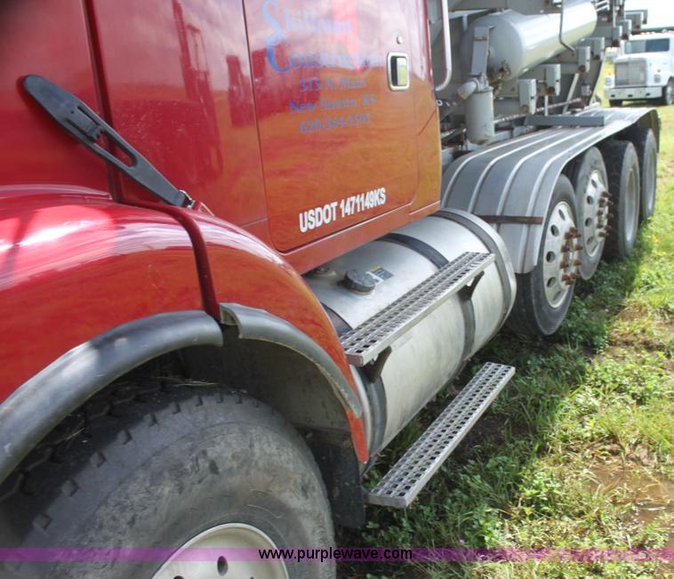 image for item I7395 2001 Volvo WG Super Stone Slinger semi truck