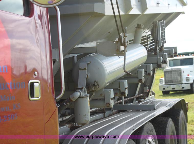 image for item I7395 2001 Volvo WG Super Stone Slinger semi truck