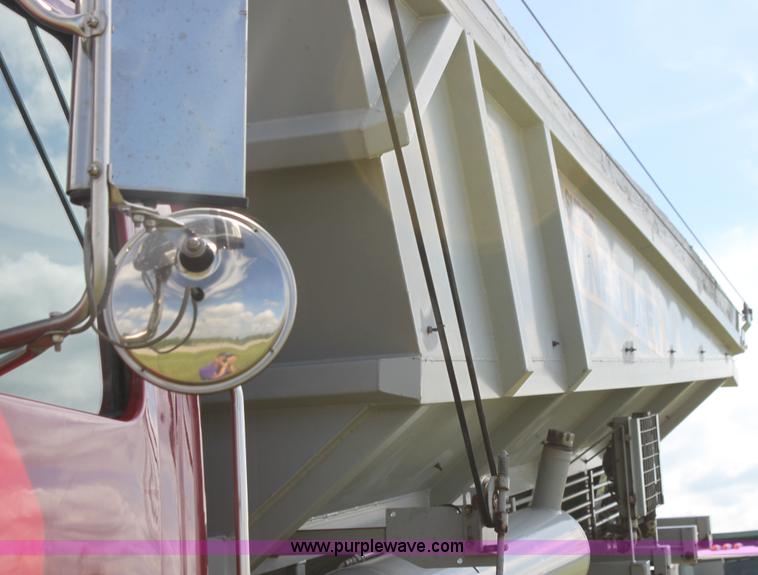 image for item I7395 2001 Volvo WG Super Stone Slinger semi truck