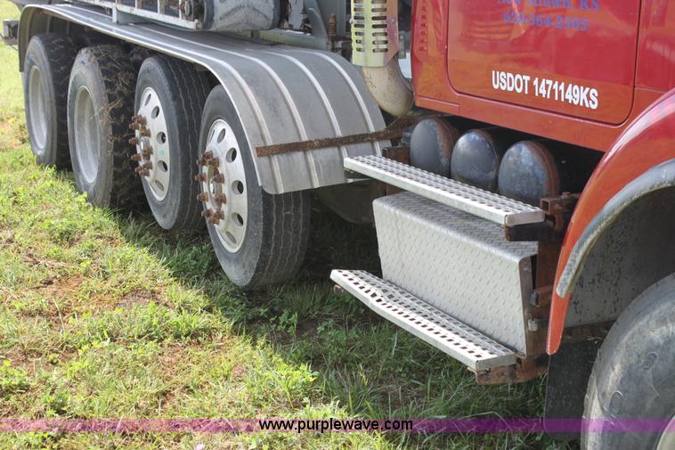 image for item I7395 2001 Volvo WG Super Stone Slinger semi truck