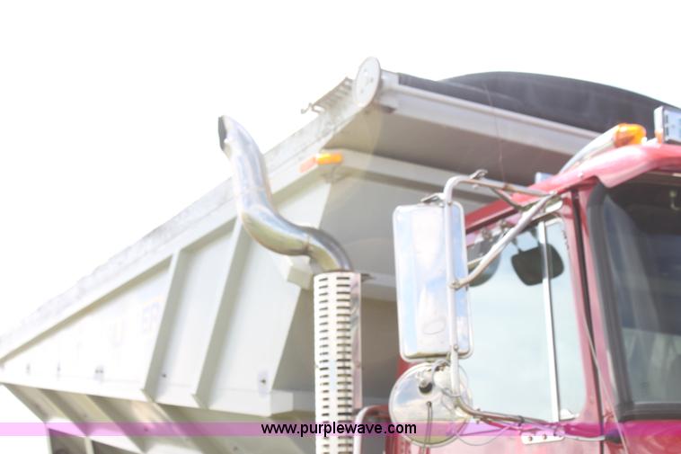 image for item I7395 2001 Volvo WG Super Stone Slinger semi truck