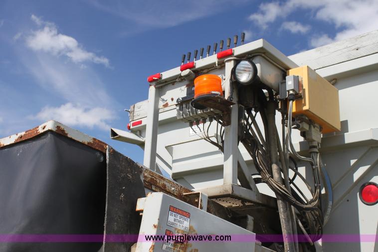 image for item I7395 2001 Volvo WG Super Stone Slinger semi truck