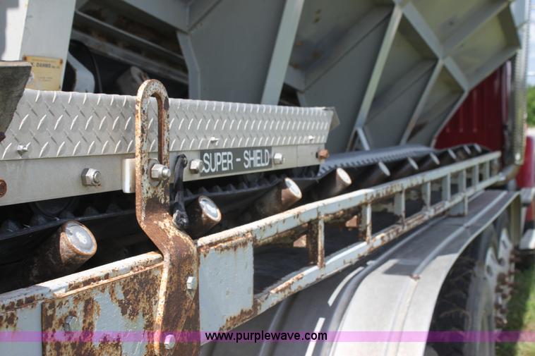 image for item I7395 2001 Volvo WG Super Stone Slinger semi truck