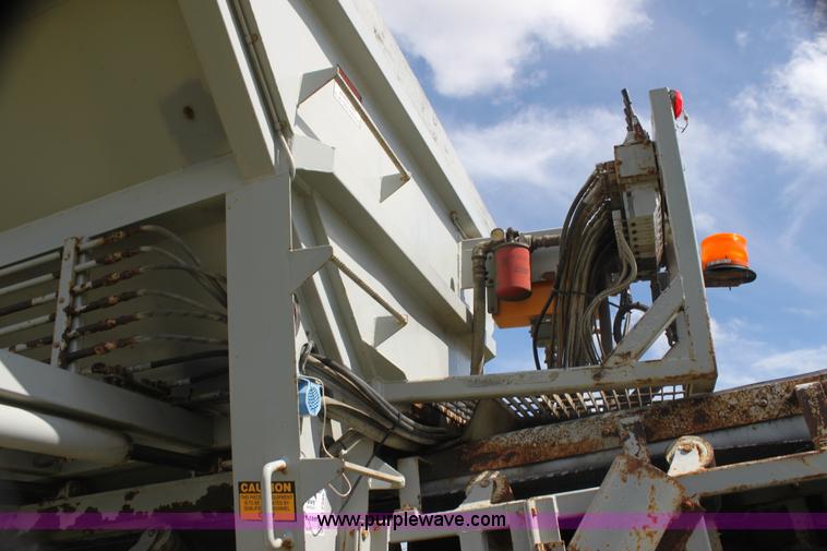 image for item I7395 2001 Volvo WG Super Stone Slinger semi truck