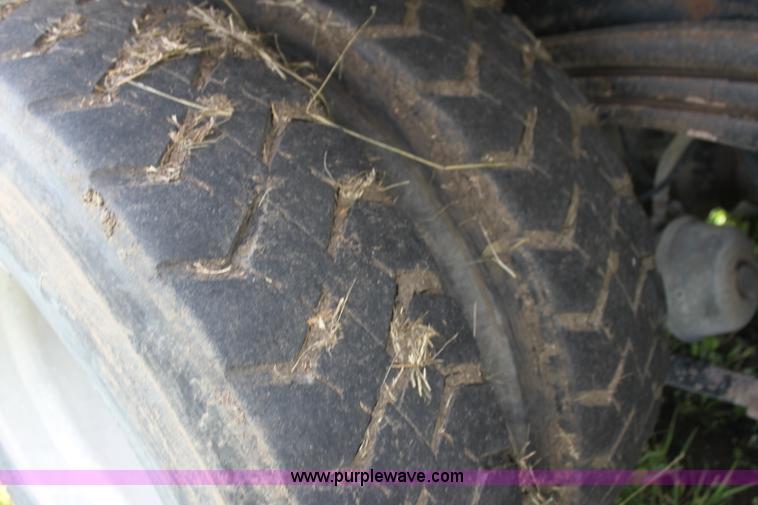 image for item I7395 2001 Volvo WG Super Stone Slinger semi truck