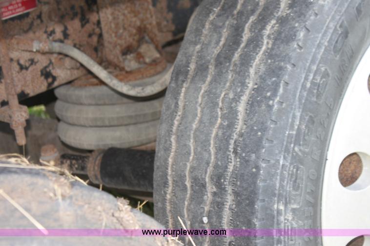 image for item I7395 2001 Volvo WG Super Stone Slinger semi truck