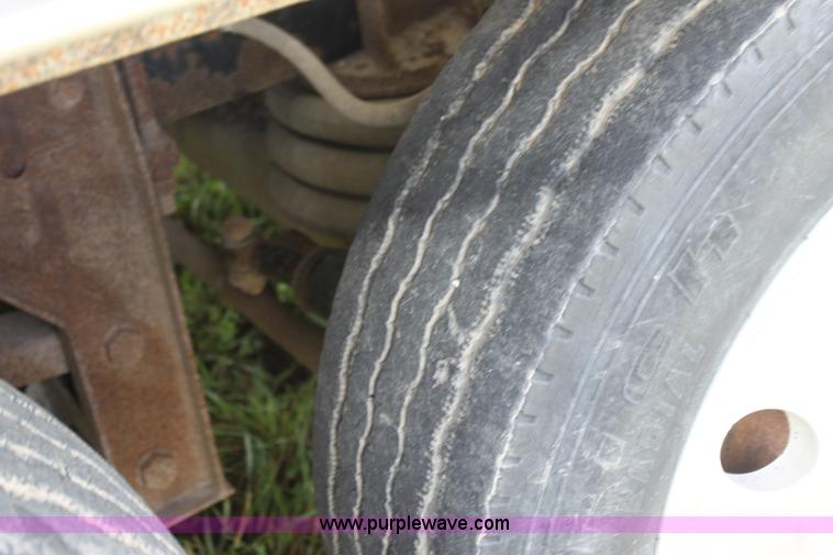 image for item I7395 2001 Volvo WG Super Stone Slinger semi truck