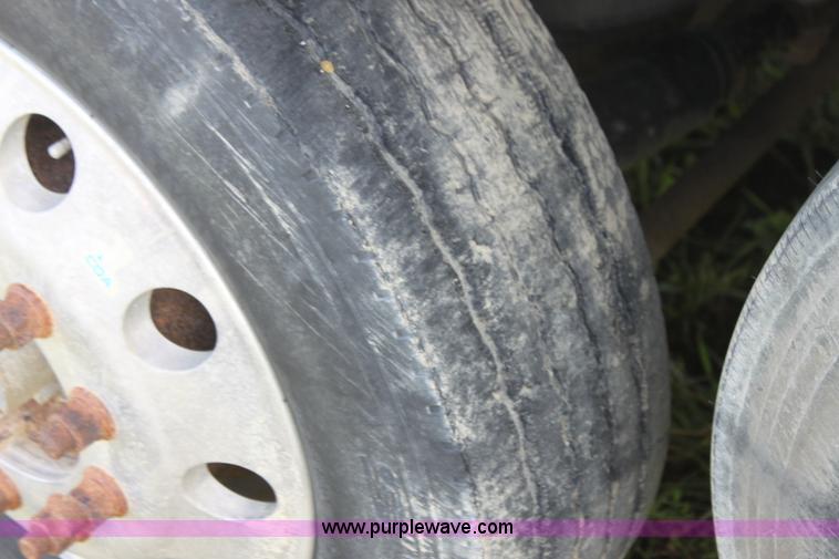 image for item I7395 2001 Volvo WG Super Stone Slinger semi truck