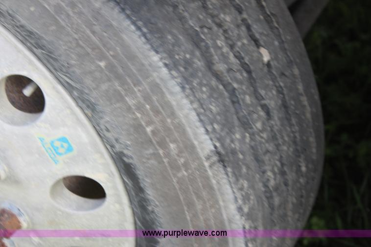 image for item I7395 2001 Volvo WG Super Stone Slinger semi truck