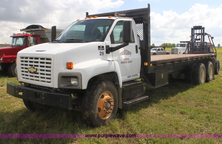 image for item I7396 2006 Chevrolet C8500 flatbed truck with forklift