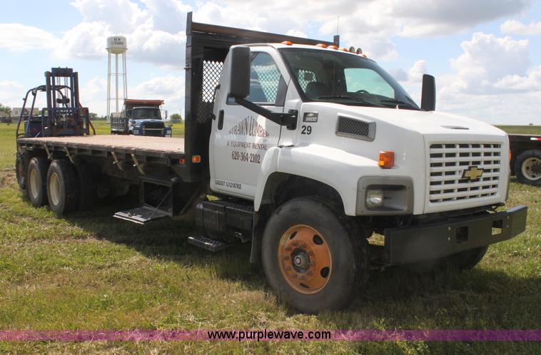 image for item I7396 2006 Chevrolet C8500 flatbed truck with forklift