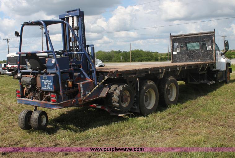 image for item I7396 2006 Chevrolet C8500 flatbed truck with forklift