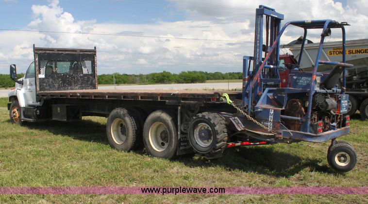 image for item I7396 2006 Chevrolet C8500 flatbed truck with forklift