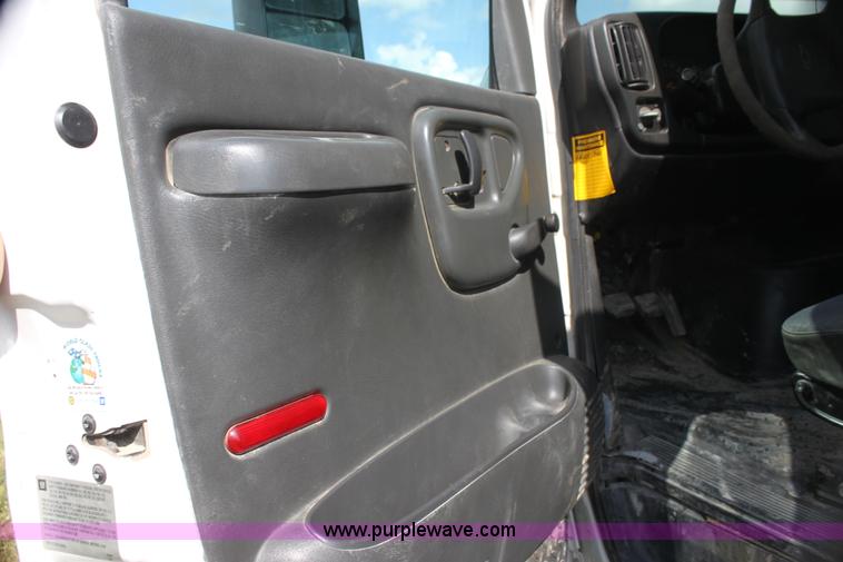 image for item I7396 2006 Chevrolet C8500 flatbed truck with forklift