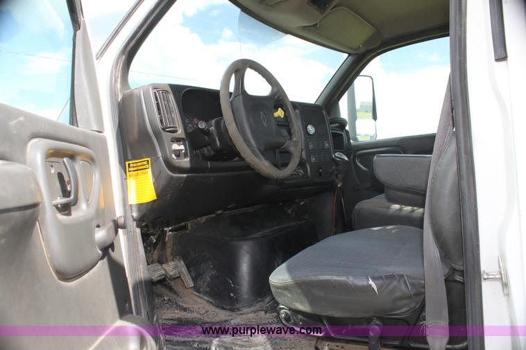 image for item I7396 2006 Chevrolet C8500 flatbed truck with forklift