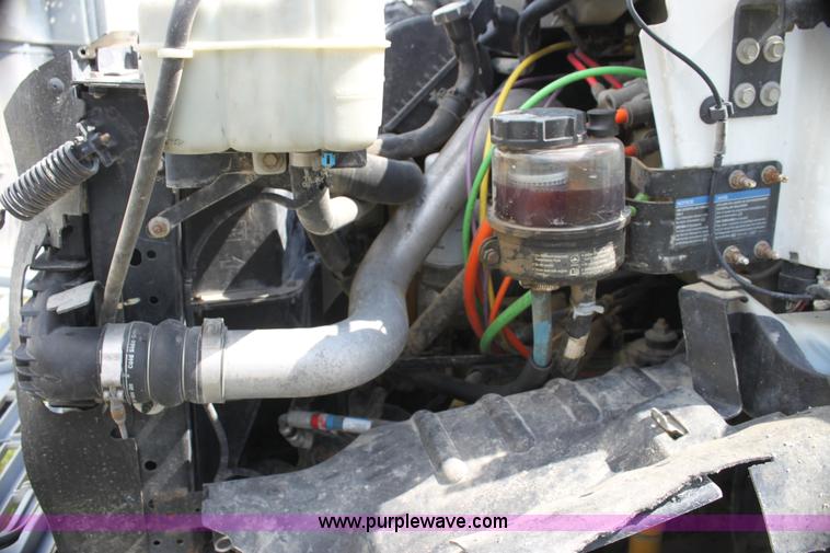 image for item I7396 2006 Chevrolet C8500 flatbed truck with forklift