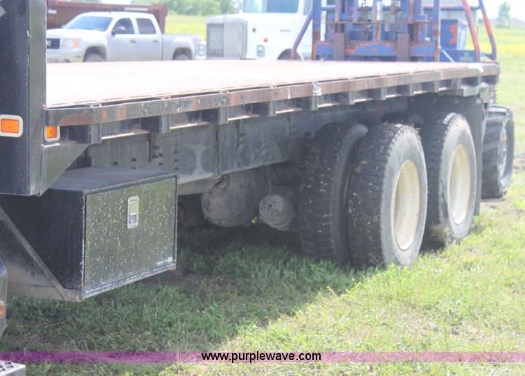 image for item I7396 2006 Chevrolet C8500 flatbed truck with forklift