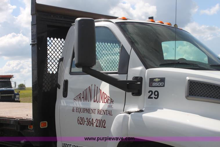 image for item I7396 2006 Chevrolet C8500 flatbed truck with forklift
