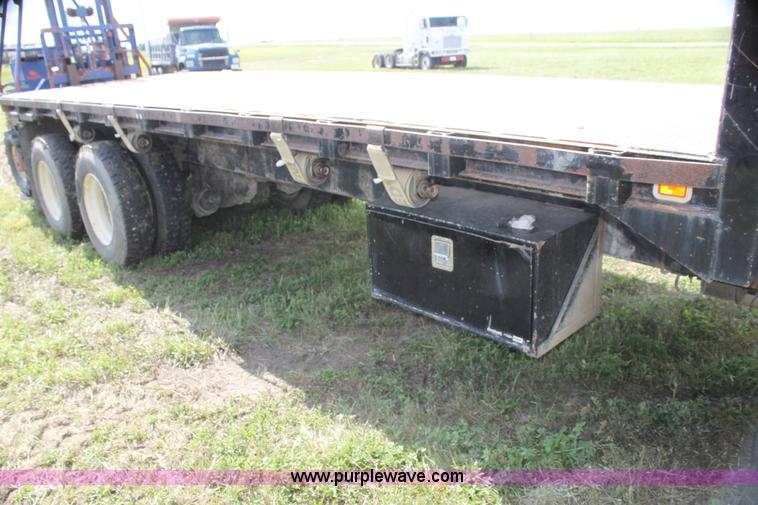 image for item I7396 2006 Chevrolet C8500 flatbed truck with forklift