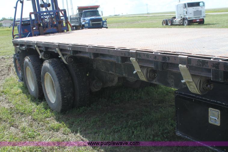 image for item I7396 2006 Chevrolet C8500 flatbed truck with forklift