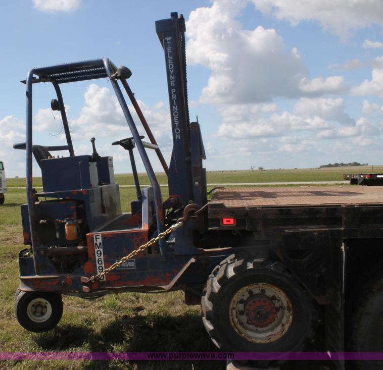 image for item I7396 2006 Chevrolet C8500 flatbed truck with forklift