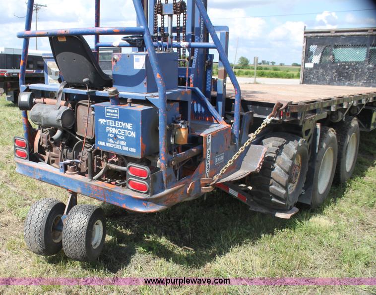 image for item I7396 2006 Chevrolet C8500 flatbed truck with forklift