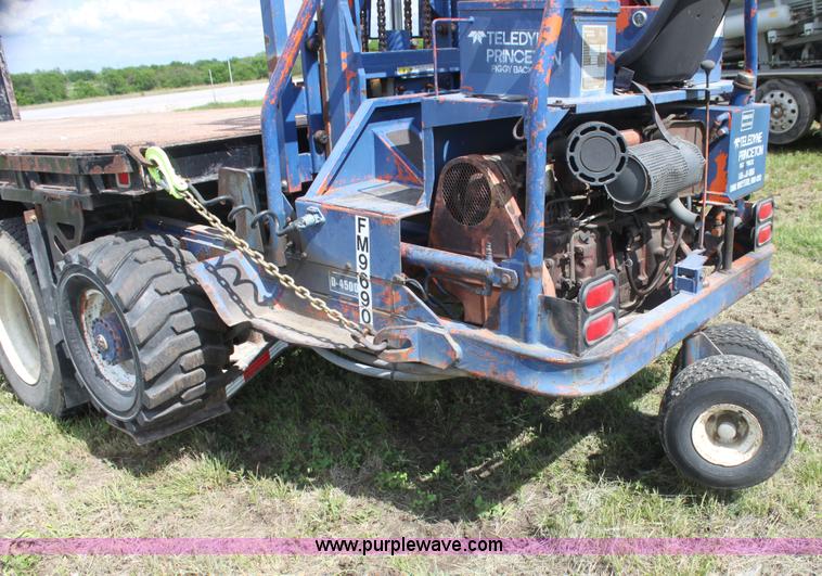 image for item I7396 2006 Chevrolet C8500 flatbed truck with forklift