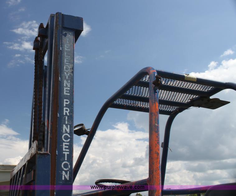 image for item I7396 2006 Chevrolet C8500 flatbed truck with forklift