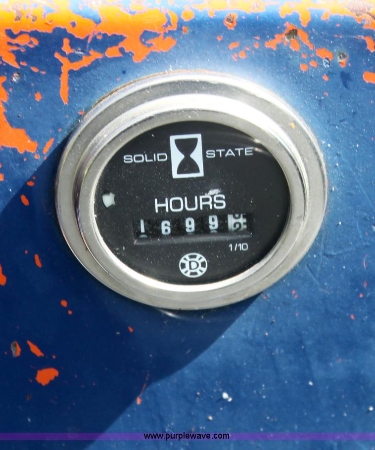 image for item I7396 2006 Chevrolet C8500 flatbed truck with forklift