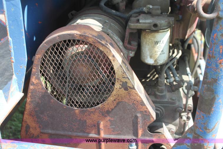 image for item I7396 2006 Chevrolet C8500 flatbed truck with forklift