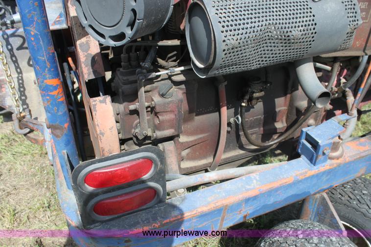 image for item I7396 2006 Chevrolet C8500 flatbed truck with forklift