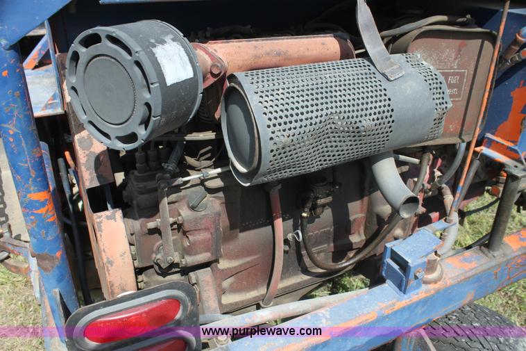 image for item I7396 2006 Chevrolet C8500 flatbed truck with forklift