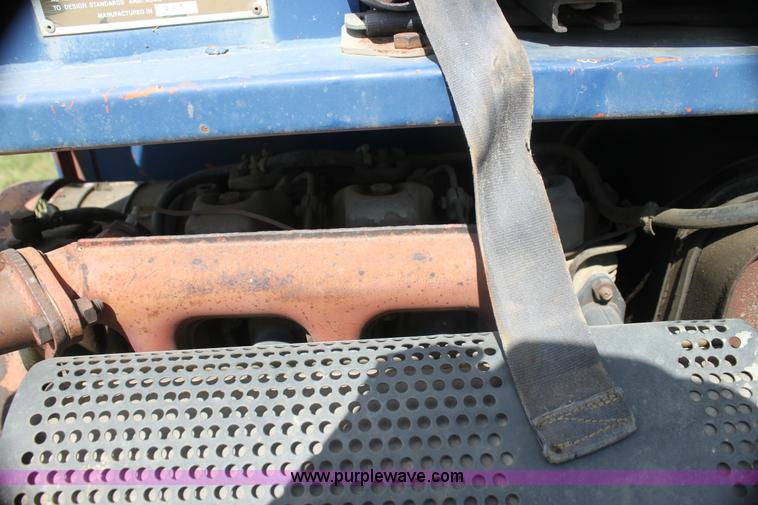 image for item I7396 2006 Chevrolet C8500 flatbed truck with forklift