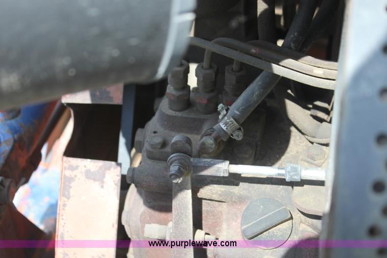 image for item I7396 2006 Chevrolet C8500 flatbed truck with forklift