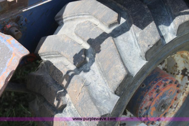 image for item I7396 2006 Chevrolet C8500 flatbed truck with forklift