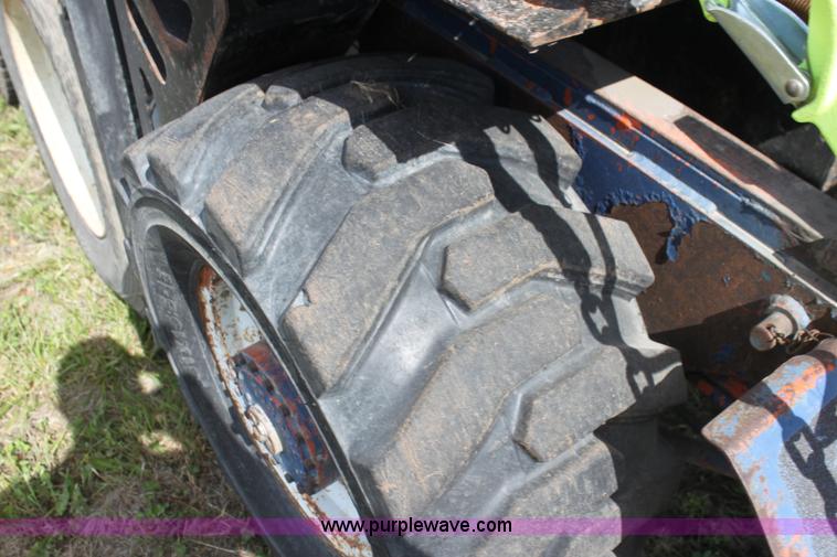 image for item I7396 2006 Chevrolet C8500 flatbed truck with forklift