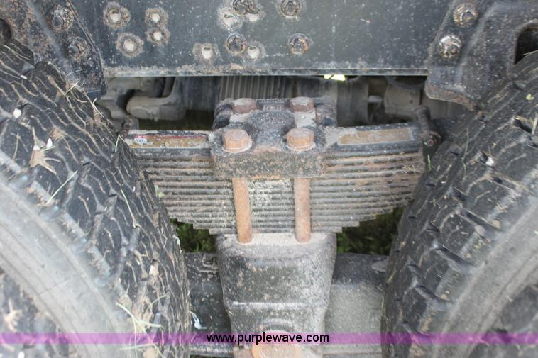 image for item I7396 2006 Chevrolet C8500 flatbed truck with forklift