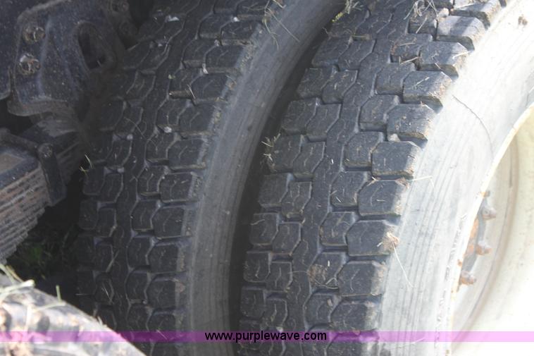 image for item I7396 2006 Chevrolet C8500 flatbed truck with forklift