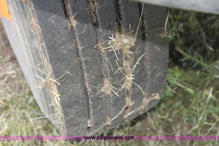 image for item I7396 2006 Chevrolet C8500 flatbed truck with forklift