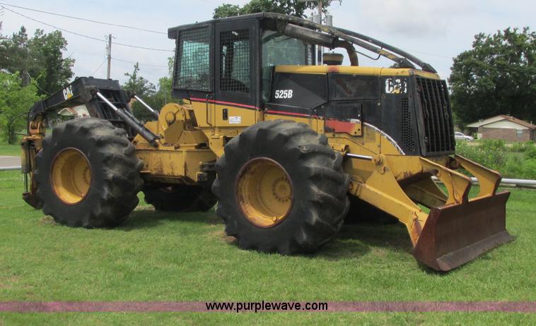 image for item J2500 2002 Caterpillar 525B grapple skidder