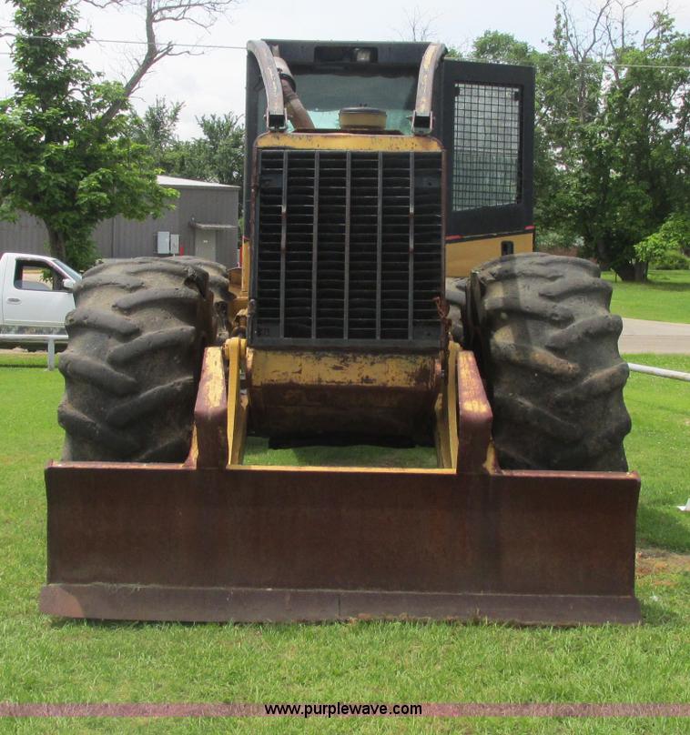 image for item J2500 2002 Caterpillar 525B grapple skidder
