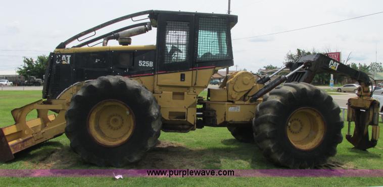 image for item J2500 2002 Caterpillar 525B grapple skidder