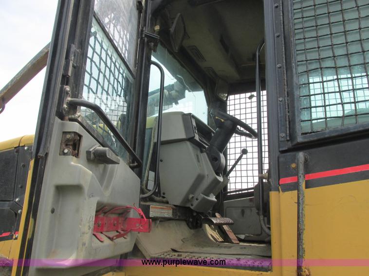 image for item J2500 2002 Caterpillar 525B grapple skidder