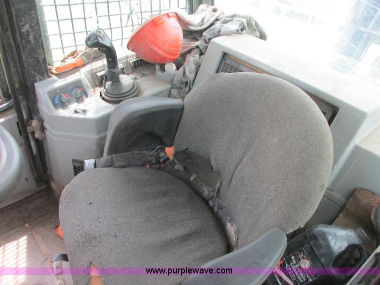 image for item J2500 2002 Caterpillar 525B grapple skidder